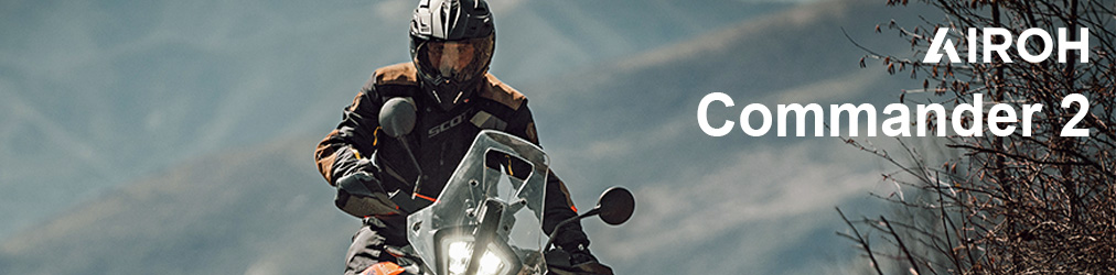 Airoh Helme - Mann auf Tourenmotorrad vor Bergen mit Airoh Commander 2 Helm